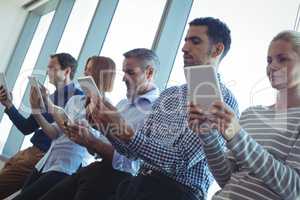 Business people using digital tablets at office