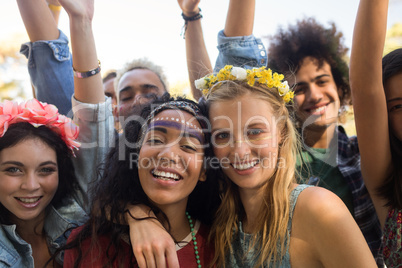 Portrait of friends enjoying at music festival