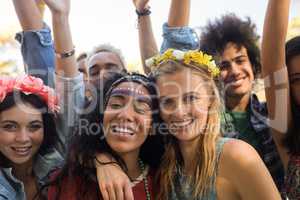 Portrait of friends enjoying at music festival
