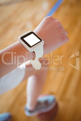 Cropped image of woman wearing smartwatch