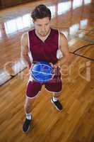Full length of basketball player with ball