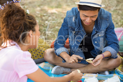 Smiling friends preparing smores