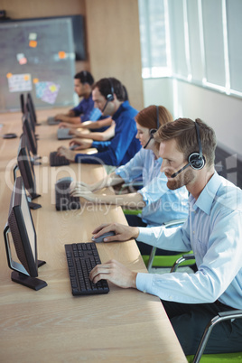 High angle view of business people working at call center