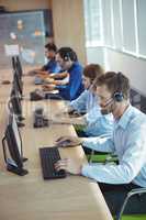 High angle view of business people working at call center