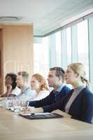 Business people sitting at conference table during meeting
