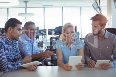 Business people working together on digital tablets