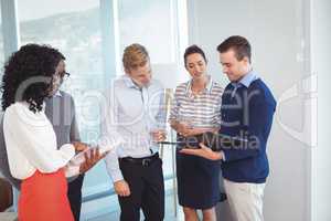 Young business people discussing in office