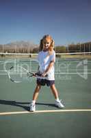 Portrait of girl playing tennis