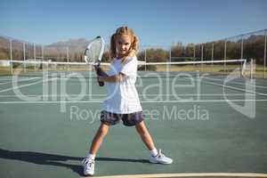 Full length of girl playing tennis