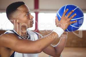 Close up of teenager practicing basketball