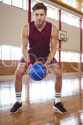 Portrait of man playing basketball