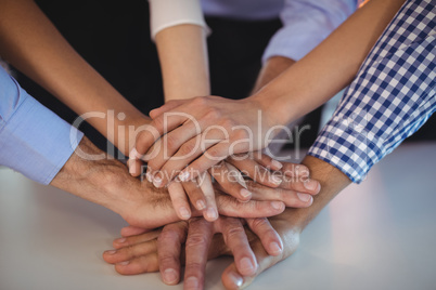 Close up of business colleagues stacking their hands