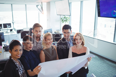 Portrait of colleagues discussing business plans