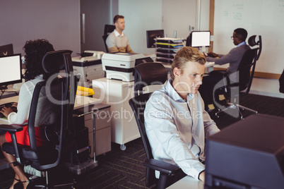 Business colleagues working at desk