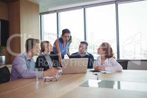 Business people discussing during metting in board room
