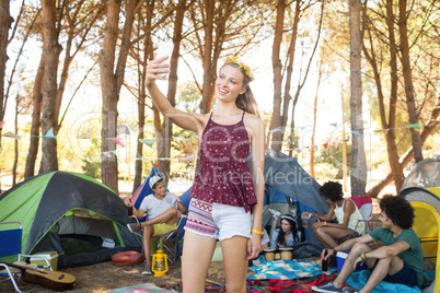 Smiling woman taking selfie