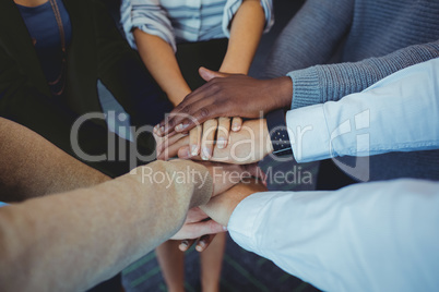 High angle view of business colleagues stacking hands