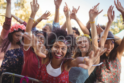 Cheerful woman enjoying at music festival