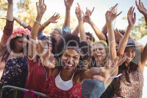 Cheerful woman enjoying at music festival