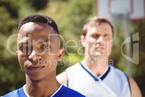 Portrait of teenage boy with friend in background