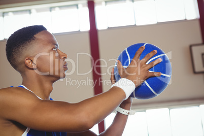 Close up of male teenager with basketball