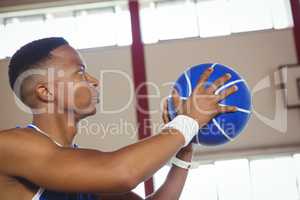 Close up of male teenager with basketball