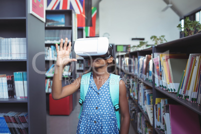 Girl gesturing while wearing virtual reality simulator