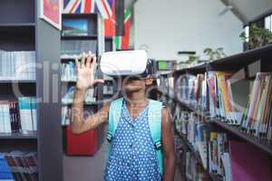 Girl gesturing while wearing virtual reality simulator