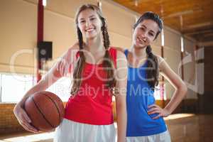 Portrait of happy female basketball players