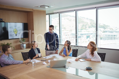 Young business partners discussing in meeting