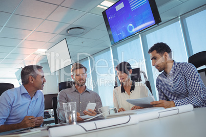 Tilt image of business people discussing at office