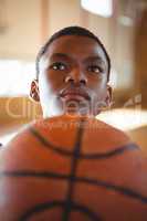 Thoughtful teenage basketball player