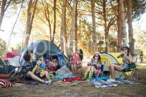 Young friends enjoying together at campsite