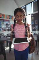 Smiling girl using tablet computer