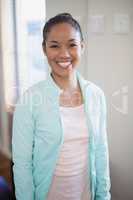 Portrait of smiling young female therapist