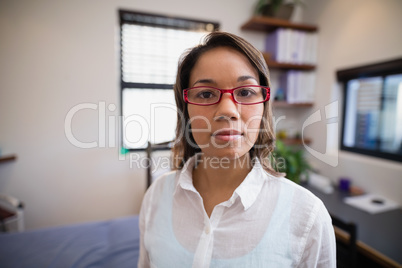 Portrait of young female therapist wearing sunglasses