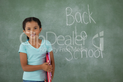 Young girl holding books