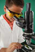 Schoolboy using microscope