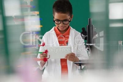 Schoolboy using digital tablet