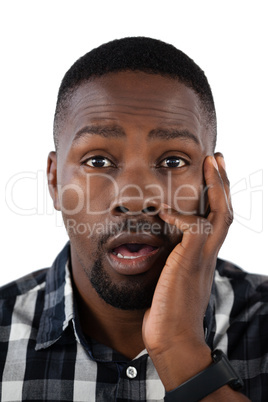 Surprised man against white background