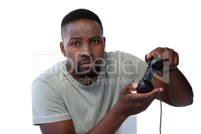 Man playing video game against white background