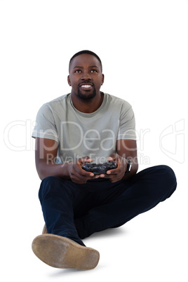 Man playing video game against white background