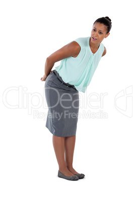 Surprised businesswoman bending and looking away