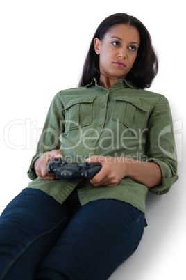 Thoughtful woman playing video games