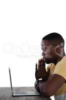 Man using laptop against white background