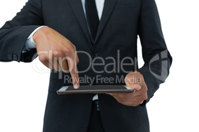 Mid section of businessman using digital table