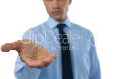 Mid section of businessman extending hand