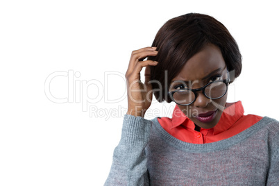 Confused woman with hand in hair