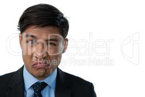 Portrait of businessman making a face