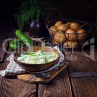 fresh cucumber salad with yogurt and young potatoes